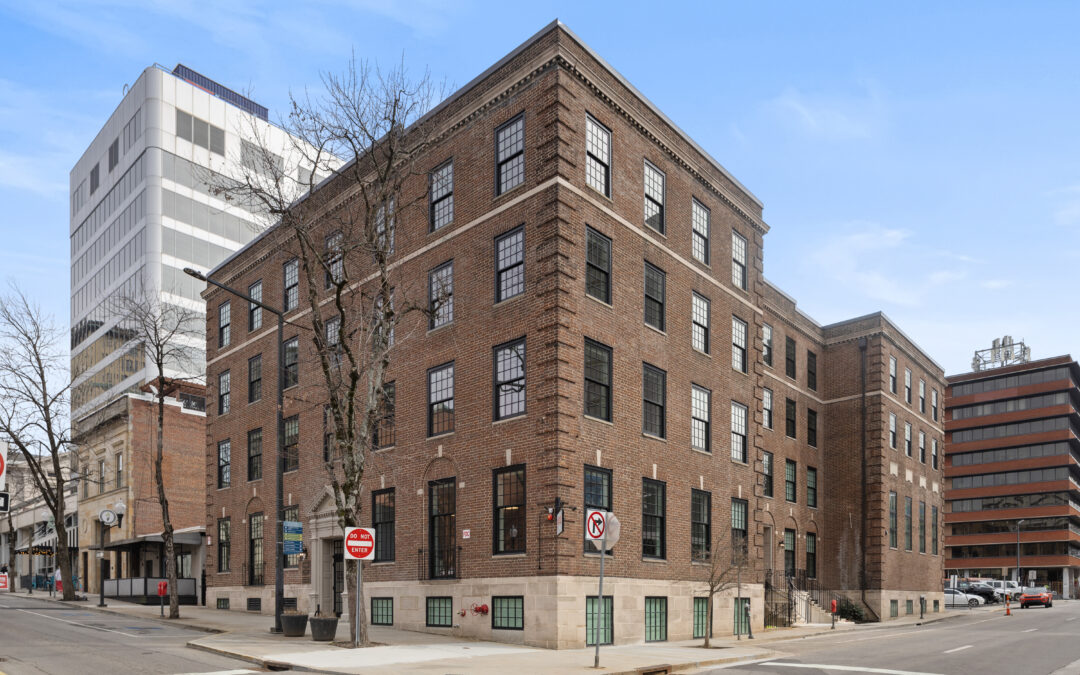 Exterior view of the restored YWCA Knoxville building, highlighting its historic facade and preserved 1925 architectural character after renovation.